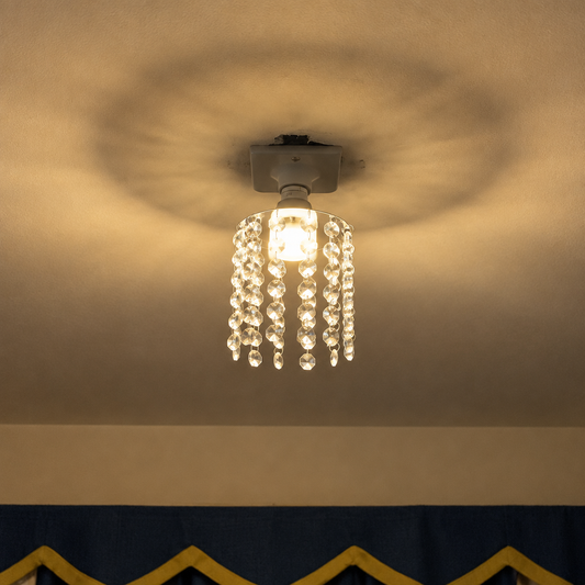 E27 crystal chandelier bulb casting a warm decorative ceiling pattern